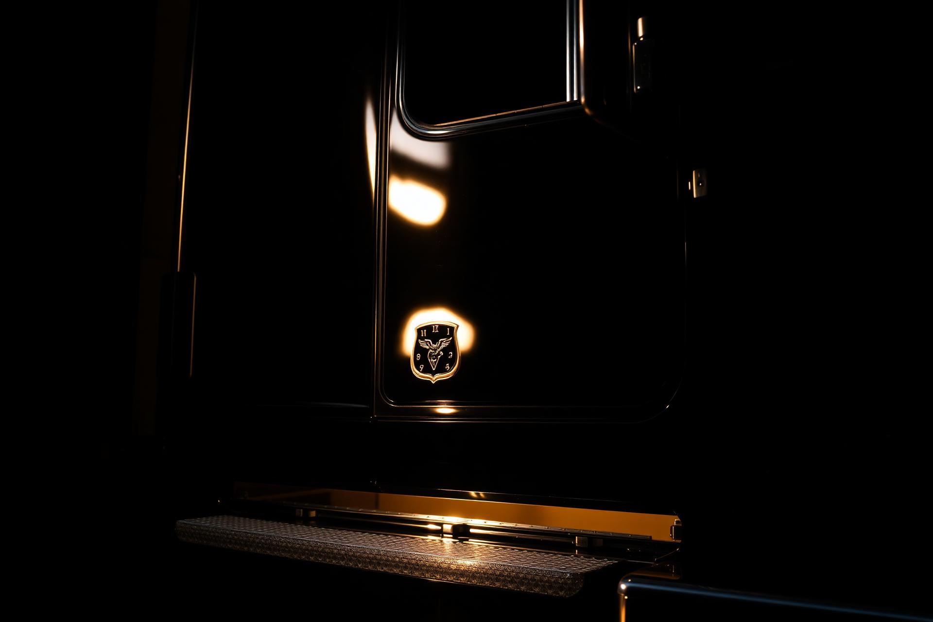 Glossy black semi-truck cab freshly detailed at golden hour